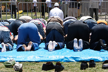 Image showing An Imam leading the prayer group