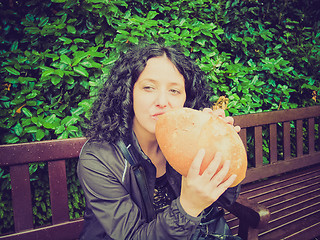 Image showing Girl eating bread