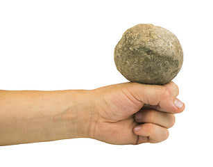 Image showing Hand holding stone ball
