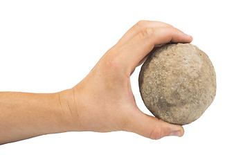 Image showing Hand holding stone ball