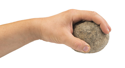 Image showing Hand holding stone ball