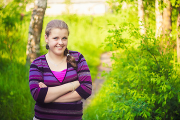 Image showing A Beautiful Young Girl Standing On A Forest Path Road