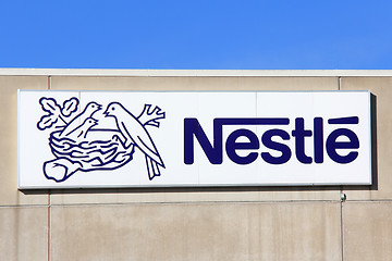 Image showing Sign Nestle with Blue Sky