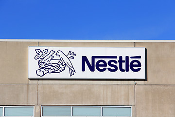Image showing Sign Nestle with Blue Sky