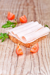 Image showing bread with sliced ham, fresh tomatoes and parsley 