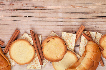 Image showing crackers, cinnamon sticks and fresh croissants