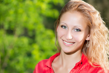 Image showing Smiling curly woman