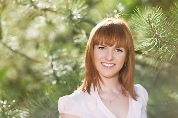 Image showing Smiling red-haired woman