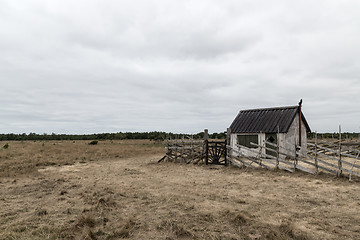 Image showing Old farm in the gloomy field