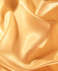 Image showing Smooth elegant golden silk as background