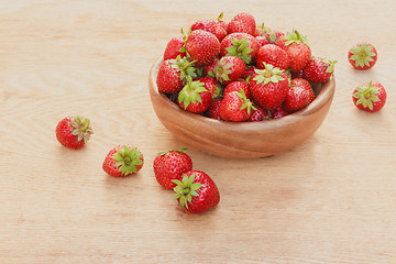 Image showing Close-Up Of Strawberries In Vintage Wooden Bowl On Table