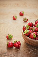 Image showing Close-Up Of Strawberries In Vintage Wooden Bowl On Table