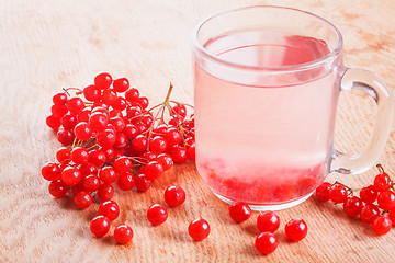 Image showing Cup of drink red ripe viburnum