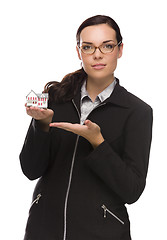 Image showing Mixed Race Businesswoman Holding Small House to the Side
