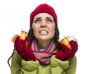 Image showing Sick Mixed Race Woman with Empty Medicine Bottles Blowing Nose 
