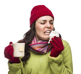 Image showing Sick Mixed Race Woman Drinks Hot Tea While Blowing Nose 
