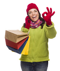 Image showing Mixed Race Woman Holding Shopping Bags On Phone Ok Gesture
