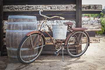 Image showing Old Rusty Antique Bicycle and Wine Barrel
