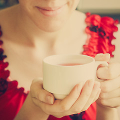 Image showing Female Hands Holding A Cup