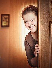 Image showing Girl Opening Door