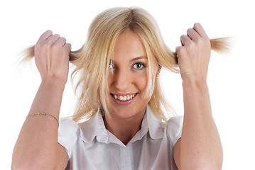 Image showing Woman with hands in hair