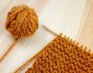 Image showing Closeup of garter stitch knitting and orange wool