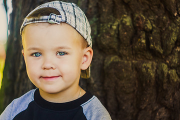 Image showing Happy child wearing striped cap in outdoor portrait