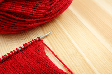 Image showing Stockinette stitch on knitting needle with red wool