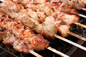 Image showing Juicy Slices Of Meat With Sauce Prepare On Fire (Shish Kebab, Sh