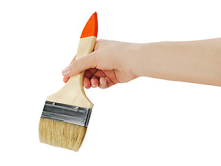 Image showing Female hand holding paint brush isolated on white background.