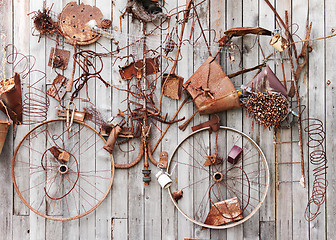 Image showing Still-life of rusty metal items on wooden background.