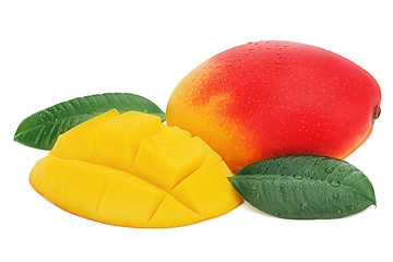 Image showing Fresh mango fruit with cut and green leaves isolated on white ba