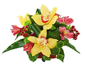 Image showing Bouquet from orchids and lilies in vase isolated on white backgr