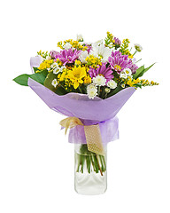 Image showing Colorful bouquet from gerberas in glass vase isolated on white b