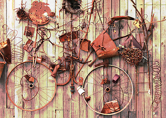 Image showing Still-life of rusty metal items on wooden background.