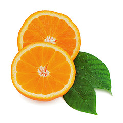 Image showing Fresh orange fruit with green leaves isolated on white backgroun