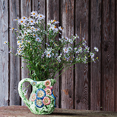Image showing Still life with blue asters in vase.