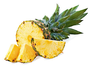 Image showing ripe pineapple with slices  isolated on white background