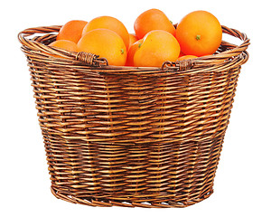 Image showing Oranges in wicker basket isolated on white.