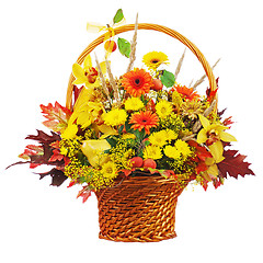 Image showing Colorful flower bouquet arrangement centerpiece in wicker basket