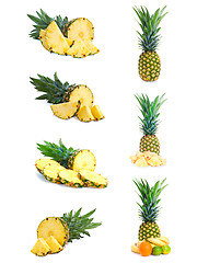 Image showing Set of fresh pineapple fruits with cut isolated on white.