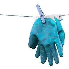 Image showing Old gardening gloves isolated on white background.