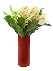 Image showing Bouquet from anturiums in red vase isolated on white background.