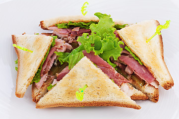 Image showing Sandwiches with  chicken, bacon and vegetables isolated on white