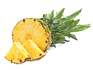 Image showing ripe pineapple with slices  isolated on white background