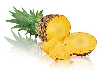 Image showing Ripe pineapple with slices isolated on white background.