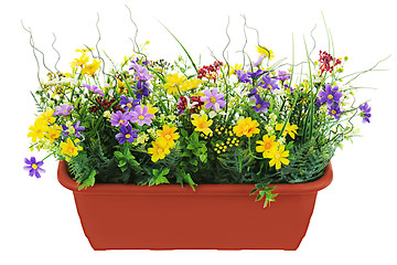 Image showing Composition of artificial garden flowers in brown flowerpot isol