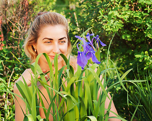 Image showing Portrait of young woman in the garden.