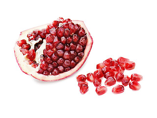 Image showing Part of pomegranate fruit isolated on white background. Closeup.