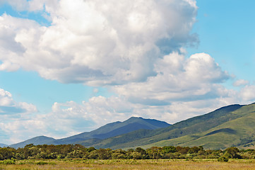 Image showing Landscape with mountain views, blue sky and beautiful clouds.